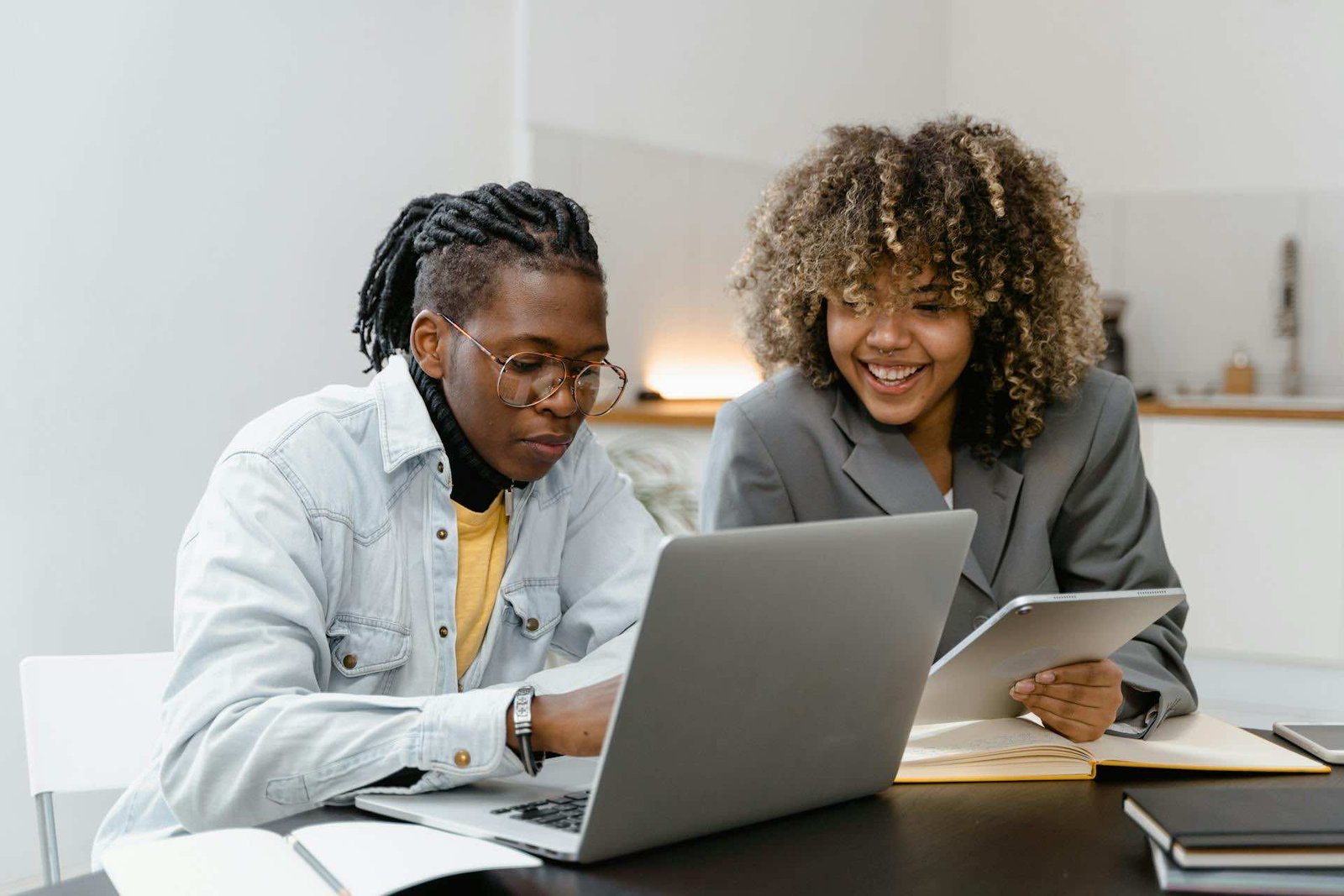 Two people on a laptop