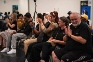 Group of people clapping at a community event group of people clapping at a community event