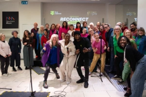 group of people posing at an intergenerational event group of people posing at an intergenerational event.